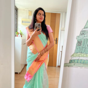 linen saree in soft mint green and golden peach accents