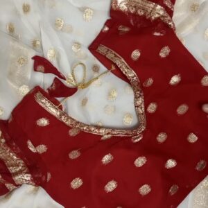 Silver organza saree with golden motifs paired with a red blouse – festive look
